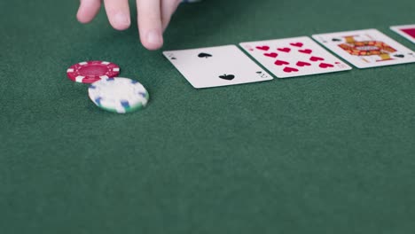 Tracking-Close-Up-Shot-from-Poker-Cards-to-Chips-Being-Bet