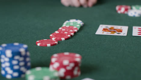 Close-Up-Shot-of-Poker-Chips-Being-Bet-