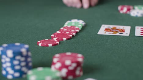 Close-Up-Shot-of-Poker-Chips-Being-Bet-