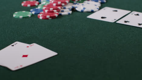 Tracking-Shot-Orbiting-Pot-as-Poker-Player-Shows-Aces