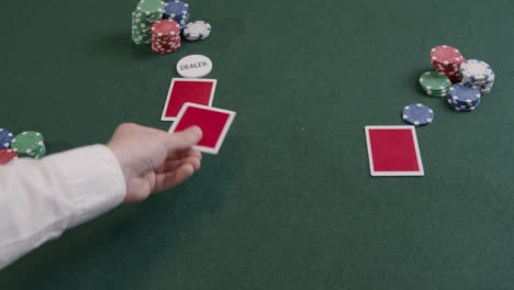 Over-the-Shoulder-Shot-of-Poker-Dealer-Dealing-Cards-