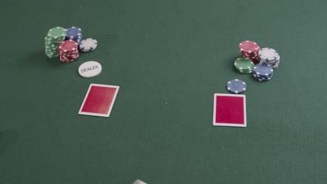 Over-the-Shoulder-Shot-of-a-Poker-Dealer-Dealing-Cards-