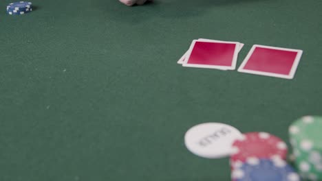 Tracking-Close-Up-Shot-of-Poker-Dealer-Drawing-the-Flop