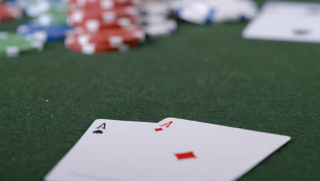 Extreme-Close-Up-Shot-of-Poker-Player-Going-All-In-and-Turning-Over-Pocket-Aces