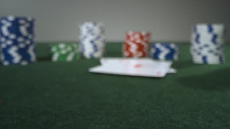 Sliding-Extreme-Close-Up-Shot-Approaching-Poker-Chips-and-Pocket-Aces