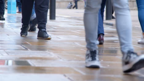 Long-Shot-of-Pavement-as-Pedestrians-Walk-Along-It-