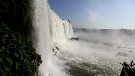 Iguaçu-Falls-Brazil-with-tourist-pointing