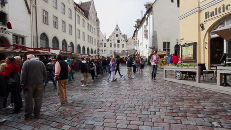 Tallinn-Estonia-tourists-walking-on-a-cobbled-street