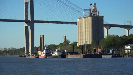 Savannah-Georgia-grain-elevator,-river,-and-bridge