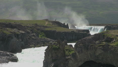 Iceland-Godafoss-waterfall-in-the-distance-beyond-cliffs