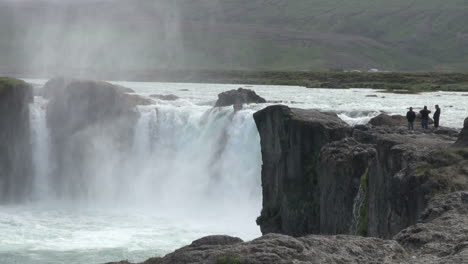 Iceland-Godafoss-waterfall-with-people-on-outcropping