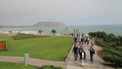 Lima-Peru-Miraflores-people-walk-in-park-by-sea