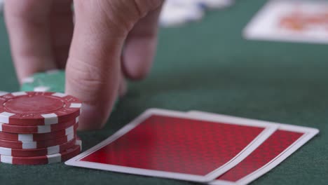 Extreme-Close-Up-Shot-of-Poker-Player-Looking-at-Ace-King-Suited