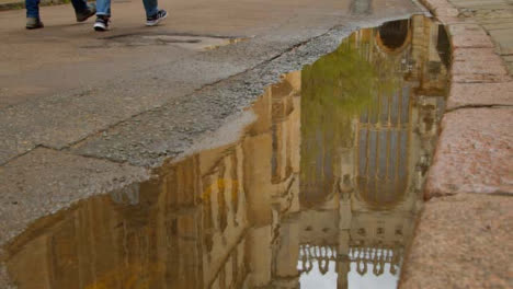 Medium-Shot-of-Puddle-Reflection-of-Kings-College-Chapel-