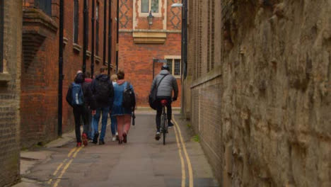 Tracking-Shot-Following-Pedestrians-and-Cyclists-In-Quiet-Backstreet