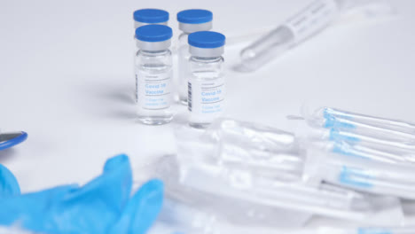 High-Angle-Shot-of-Covid-19-Vaccine-and-Medical-Items