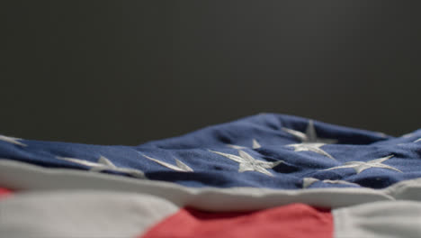 Pedestal-Shot-of-United-States-Flag-Laid-Out-
