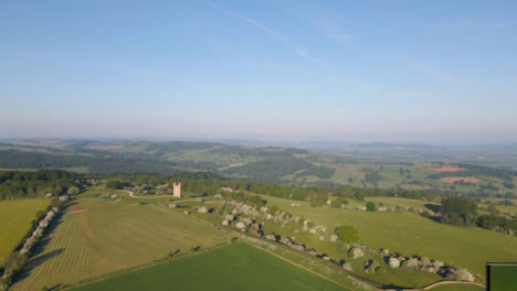 Drone-Shot-Flying-High-Over-Rolling-Cotswold-Hills-Near-the-Broadway-Tower