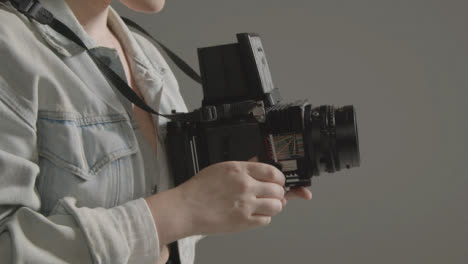 Side-Profile-Shot-of-Photographer-Using-a-Medium-Format-Camera