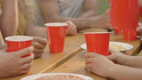 Close-Up-Shot-of-Red-Beer-Cups-Sitting-On-Table-