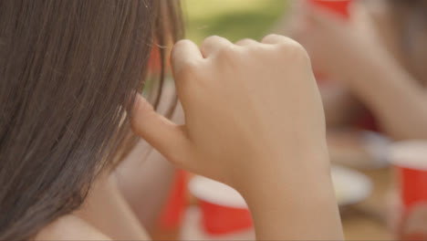 Close-Up-Shot-of-Young-Woman's-Head-Resting-Head-Against-Her-Hand