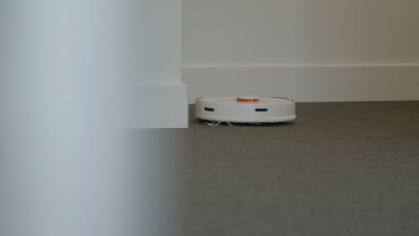 Long-Shot-of-Robotic-Vacuum-Cleaner-Cleaning-Carpet