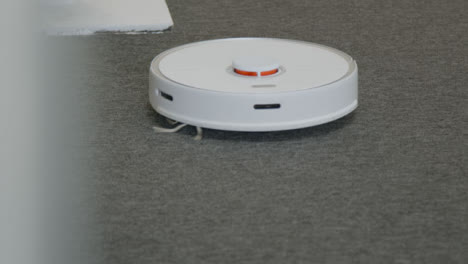 Long-Shot-of-Automatic-Robotic-Vacuum-Cleaner-Cleaning-a-Carpet