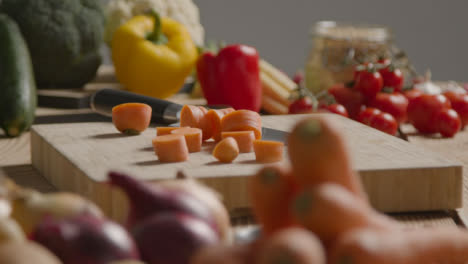 Zoom-In-Shot-of-Pile-of-Vegetables-On-Rustic-Wooden-Table