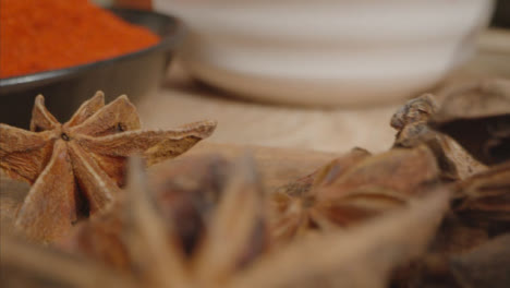 Extreme-Close-Up-Tracking-Out-Shot-of-Herbs-and-Spices-on-Table