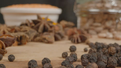 Extreme-Close-Up-Tracking-Out-Shot-from-Star-Anise-to-Spices--on-Table