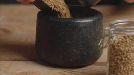 Tracking-In-Shot-with-Cumin-Poured-into-Mortar-and-Pestle