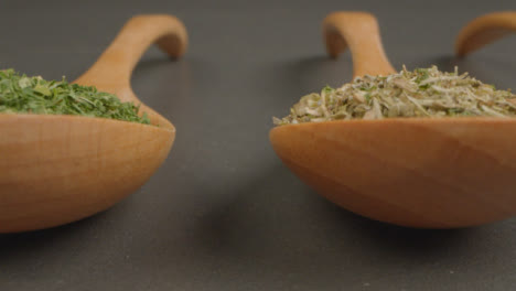 Extreme-Close-Up-Sliding-Shot-of-Herbs-and-Spices-in-Wooden-Spoons