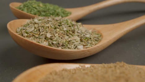 Extreme-Close-Up-Tracking-Out-Shot-of-Herbs-and-Spices-in-Wooden-Spoons
