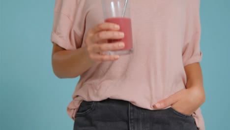 Close-Up-Shot-of-Young-Adult-Womans-Hands-Holding-Smoothie-02