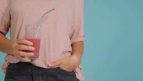 Close-Up-Shot-of-Young-Adult-Womans-Hands-Holding-Smoothie-03