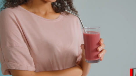 Close-Up-Shot-of-Young-Adult-Womans-Hands-Holding-Smoothie-04