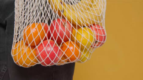 Close-Up-Shot-of-Young-Adult-Woman-Holding-Bag-of-Vegetables