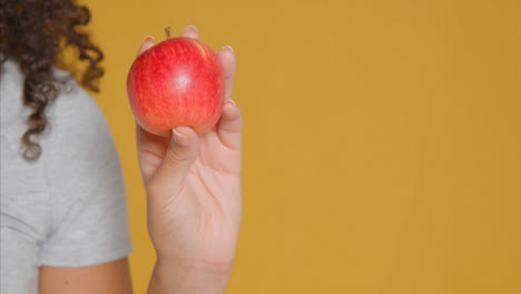 Close-Up-Shot-of-Young-Adult-Woman-Holding-Apple-01