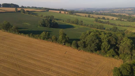 Drone-Shot-Flying-Away-from-Rural-Fields