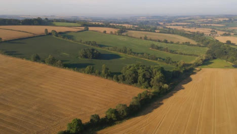 Drone-Shot-Flying-Away-from-Some-Rural-Fields