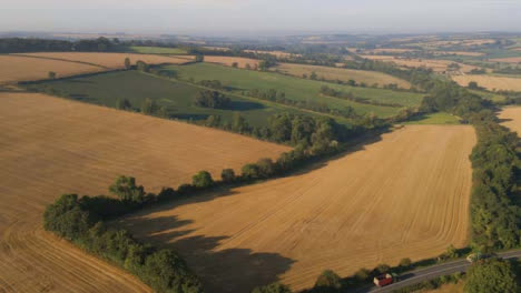 Drone-Shot-Flying-Away-from-Countryside-Fields
