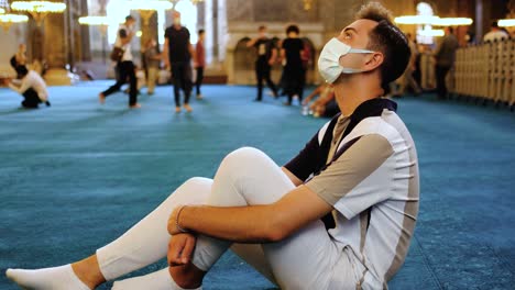 Medium-Shot-of-Young-Man-Looking-at-Hagia-Sophia-Interior