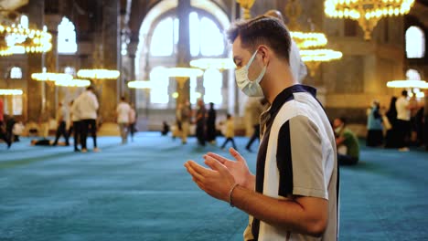 Medium-Shot-of-Young-Man-Praying-In-Hagia-Sophia-