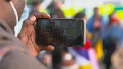 Phone-Recording-Man-Playing-Guitar-in-Protest-at-COP-26-Summit-Protest