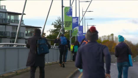 People-Walking-Past-COP-26-Signs-in-Glasgow