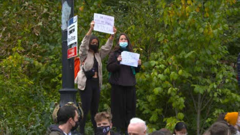 Two-Female-Protesters-Holding-Climate-Change-Signs-at-COP-26-Protest