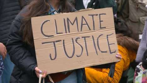 Protester-Holding-Climate-Justice-Sign-at-COP-26-Protest