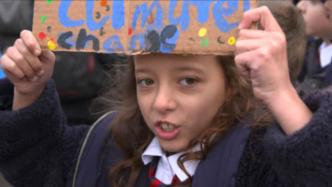 Young-Girl-Holding-Sign-and-Chanting-at-COP-26-Protest