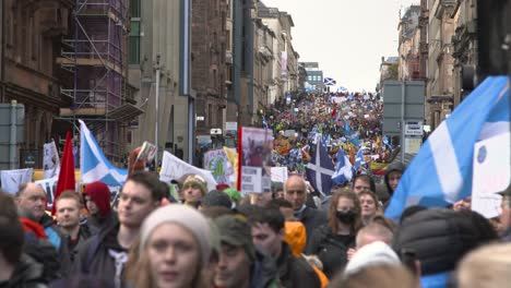 Handheld-Shot-of-Climate-Change-Protestors-Marching-In-Streets-of-Glasgow