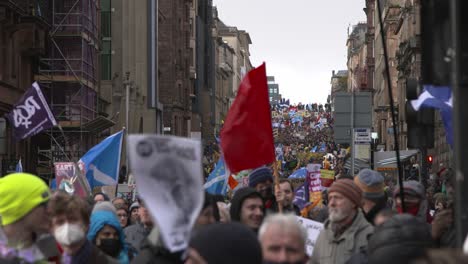 Handheld-Shot-of-Climate-Change-Protestors-Walking-Through-Streets-of-Glasgow